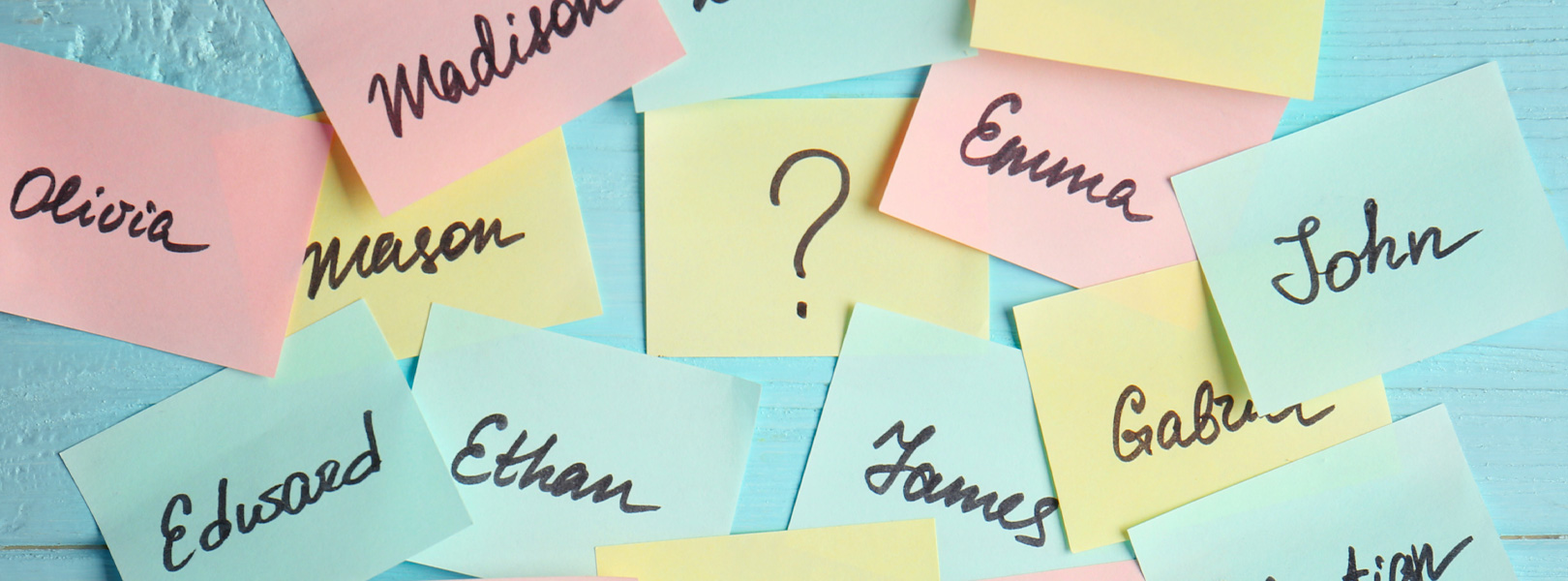 Choosing a baby name. Colorful post-its with possibilities.