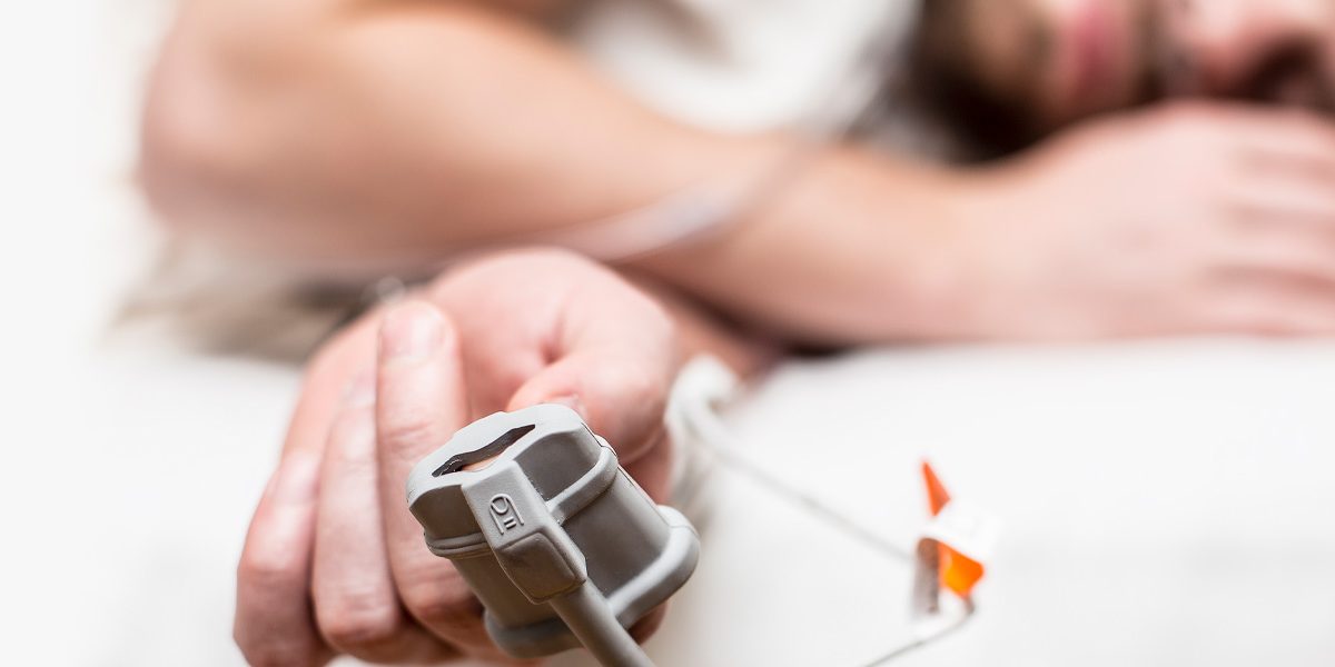 Man sleeping at-home sleep study
