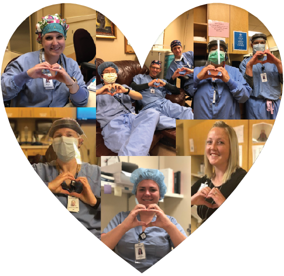 Surgery staff holding hand hearts in a heart shape.  Men and women wearing scrubs and personal protective equipment.