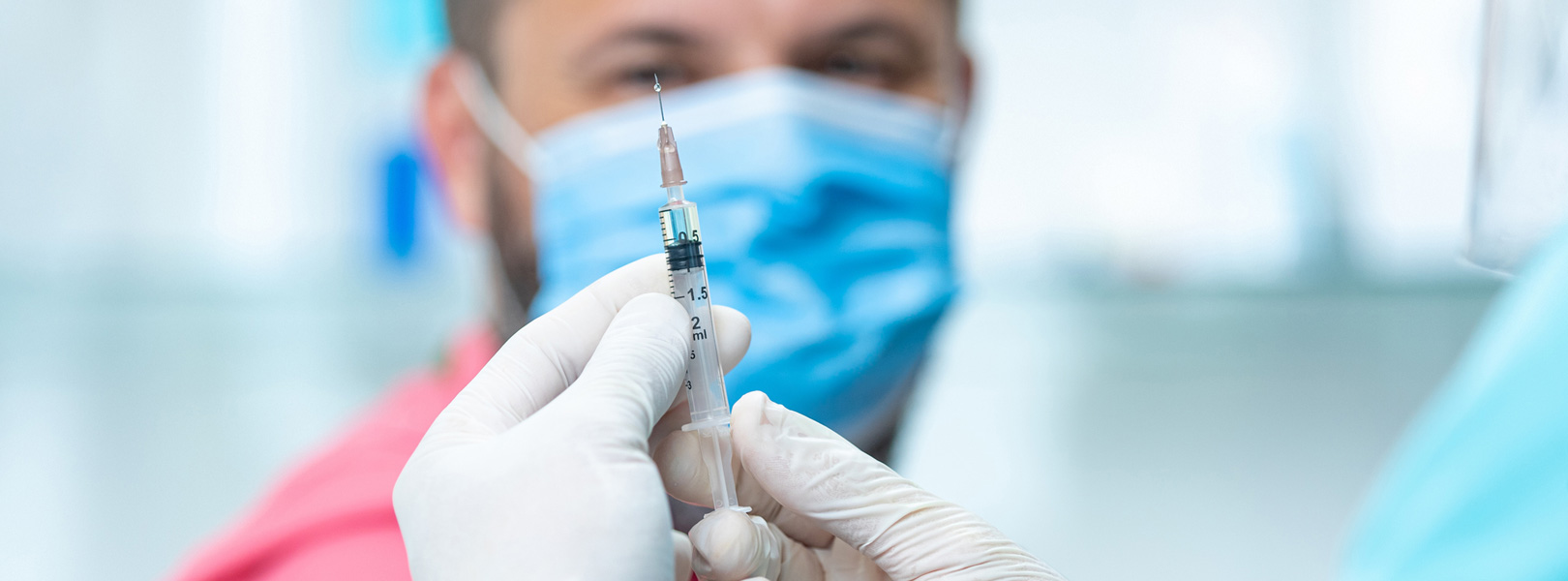 Man preparing to receive a flu shot