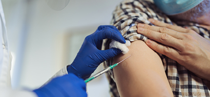 Man receiving his COVID-19 vaccine