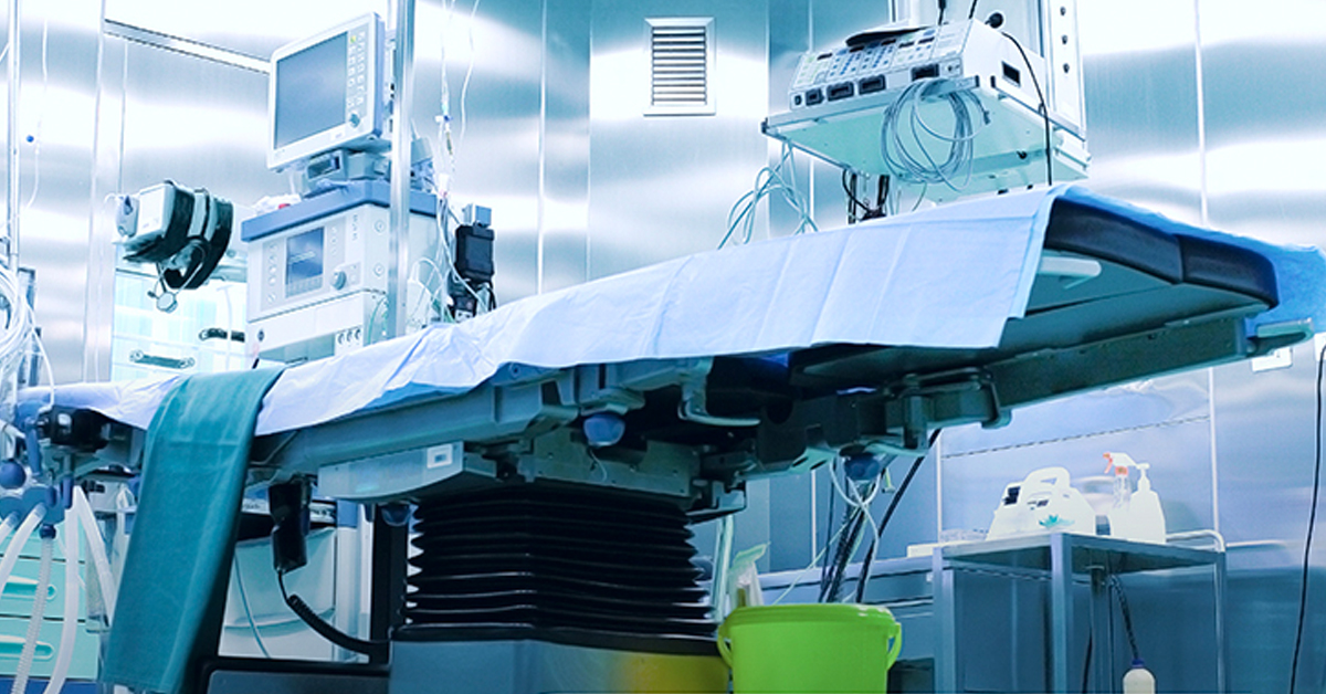 Operating room with draped operating table and monitors