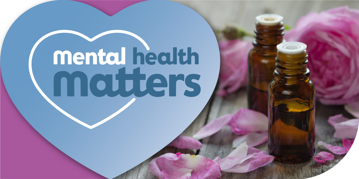 Image of roses, essential oils, and the words "mental health matters"