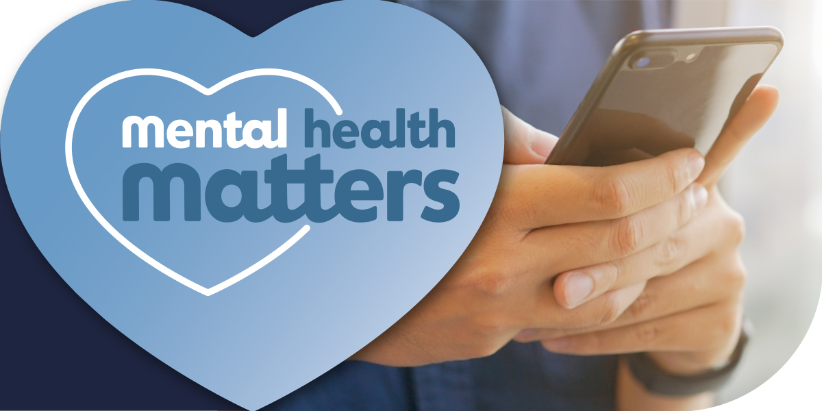 Mental health matters with close-up of a person scrolling through their phone.