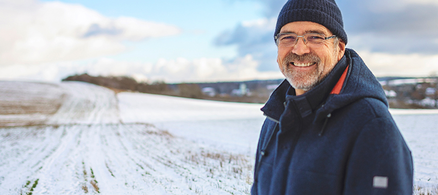 Northern MN man outside in a winter field