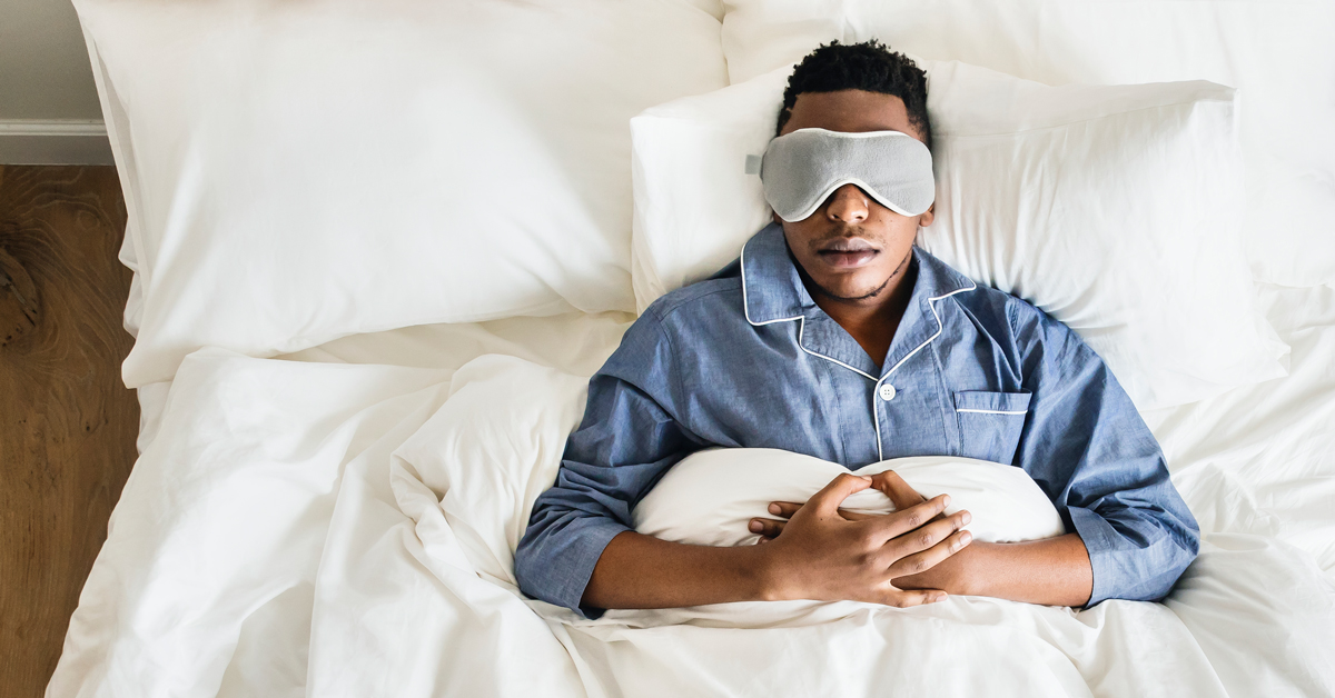 Man sleeping with an eye mask