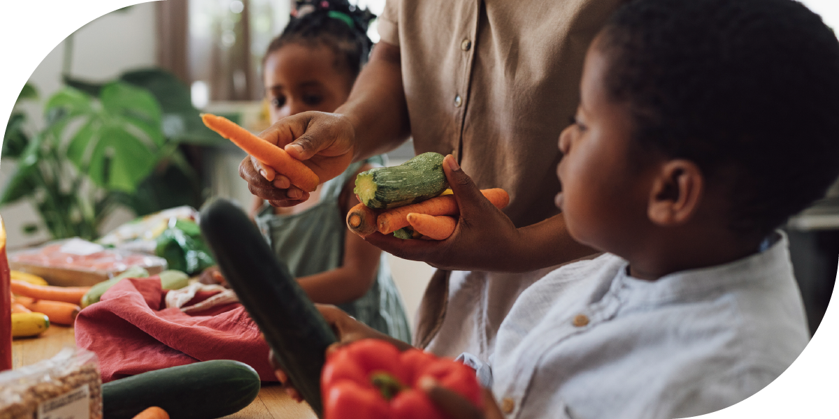 Picture of two children learning about cooking vegetables