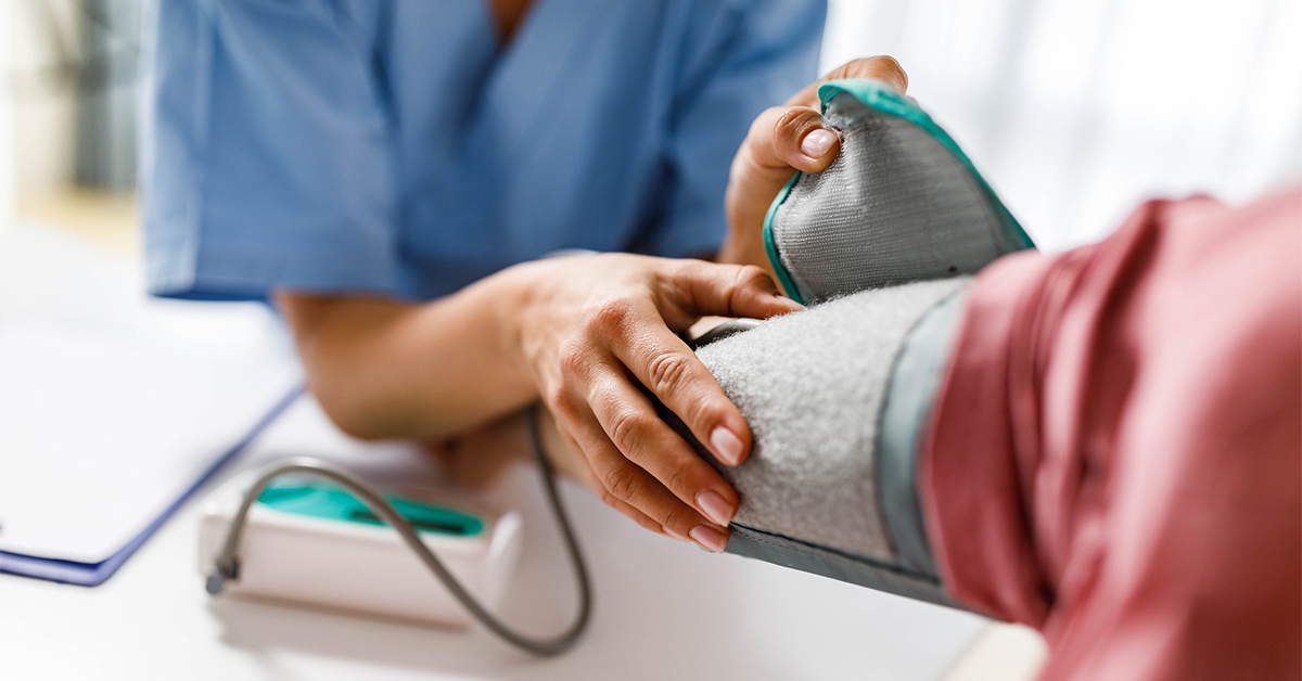 Close-up of nurse taking a patient's blood pressure