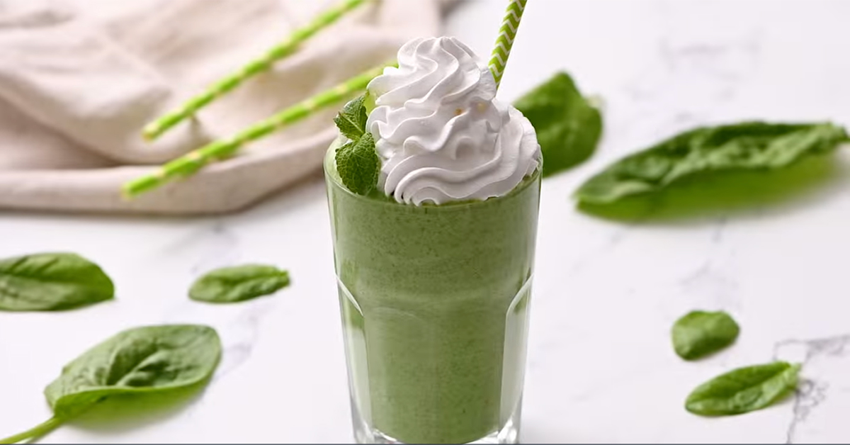 A green shamrock shake topped with whipped cream
