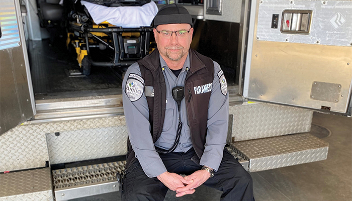 Pete Gagnon, Welia Health paramedic sitting on the back of his rig