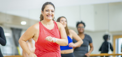 Woman exercising at a Zumba class