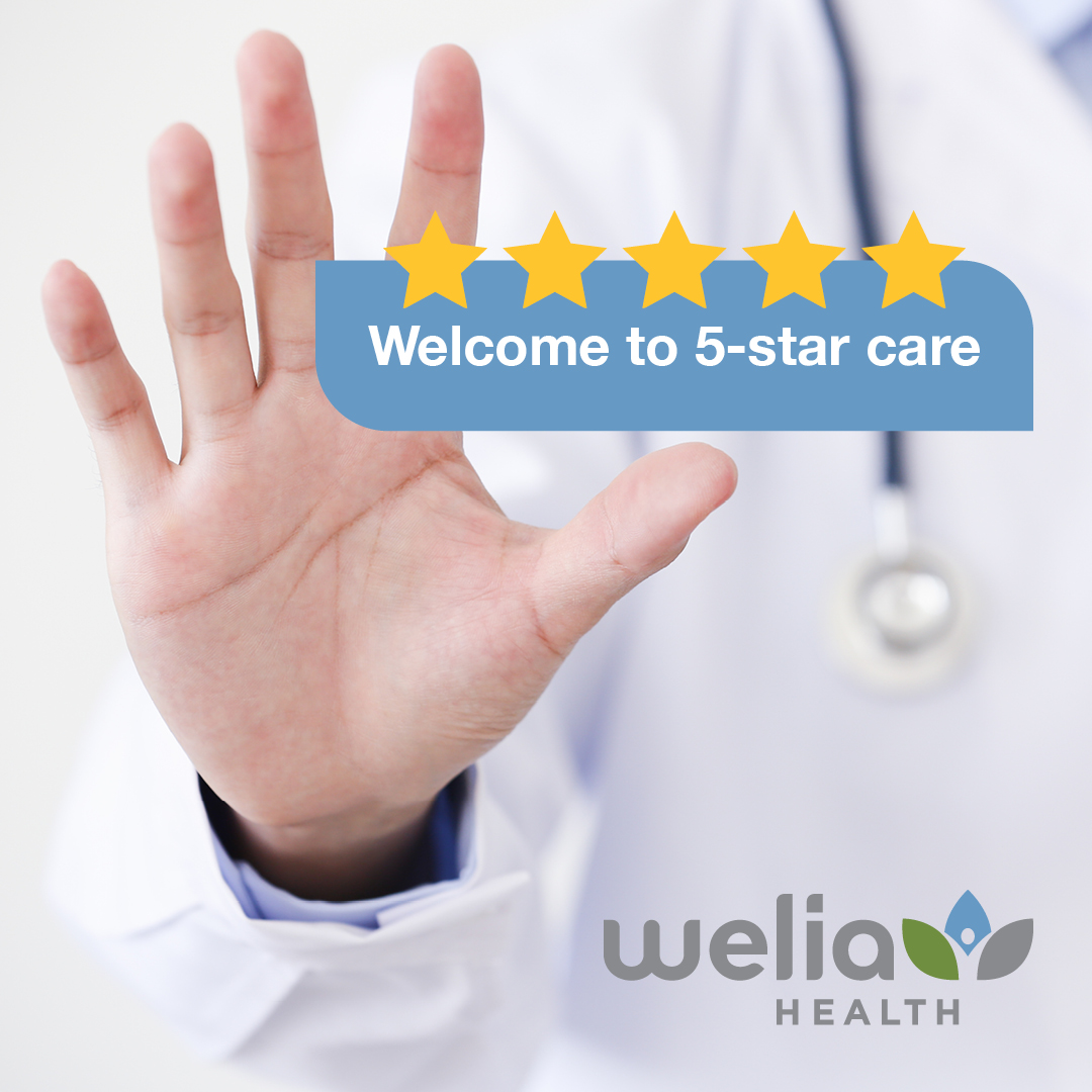 A physician holding up his hand as the number 5. Welcome to five star care with five 5 gold stars. Welia Health logo