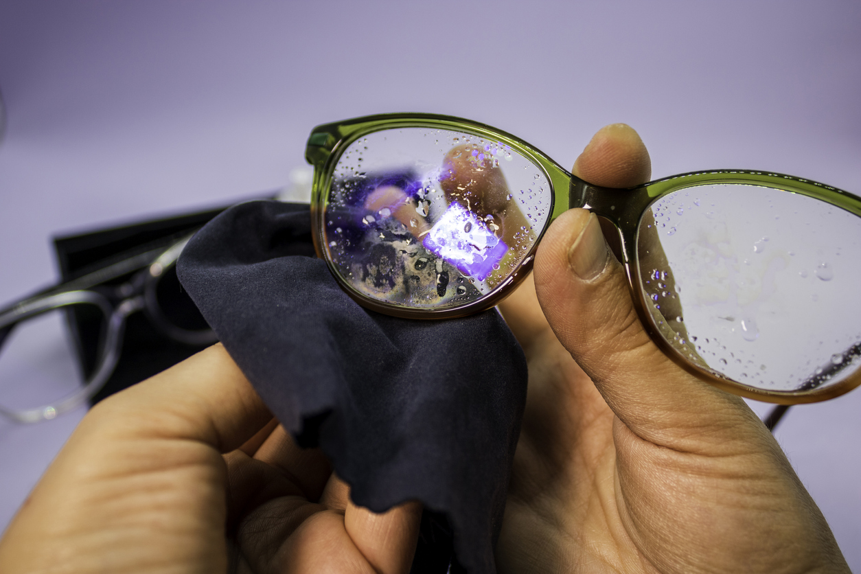 cleaning eyeglasses with microfiber and water
