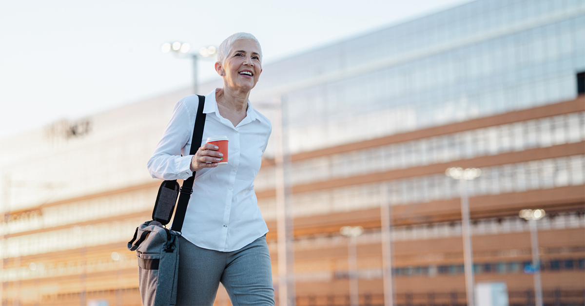 Senior woman taking a walk during her coffee break from work