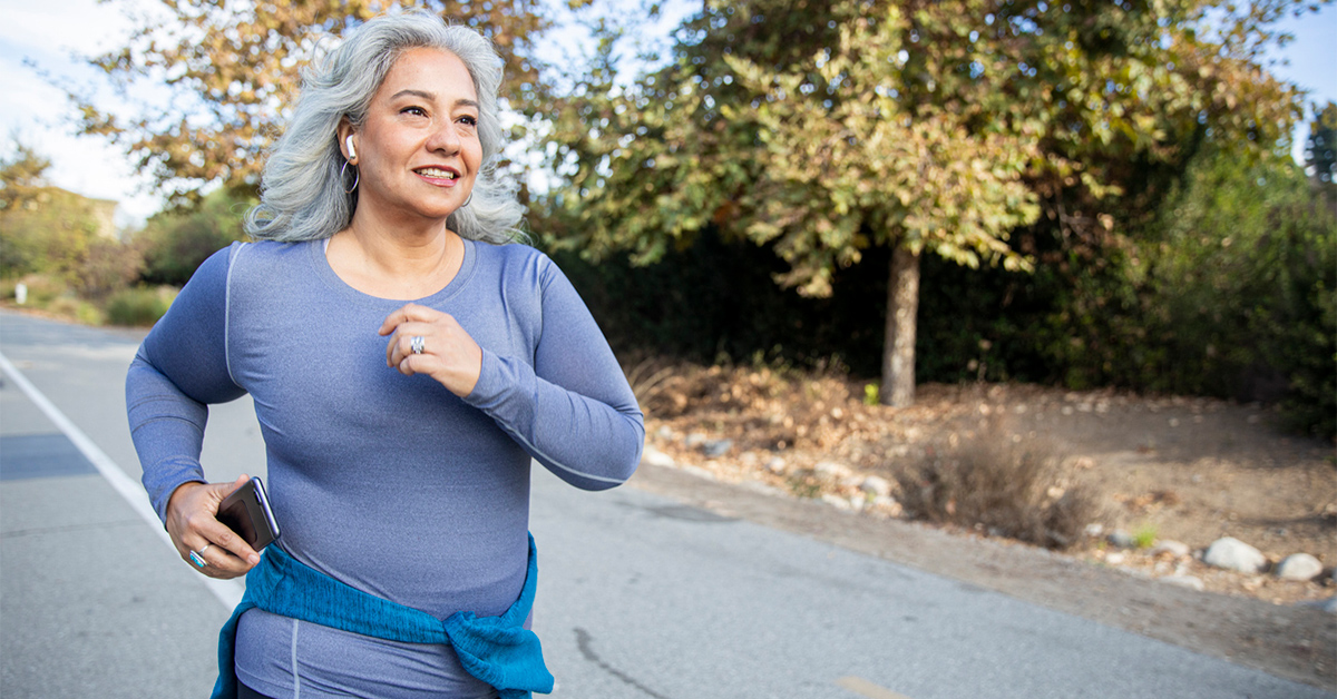 Older women running outside on a road