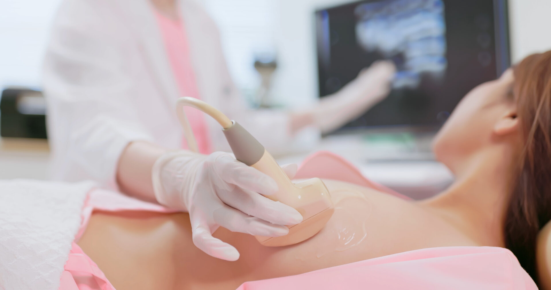 Ultrasound tech performing a breast ultrasound